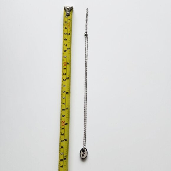 Dainty iridescent flower necklace with a small silver chain - Picture 4 of 8